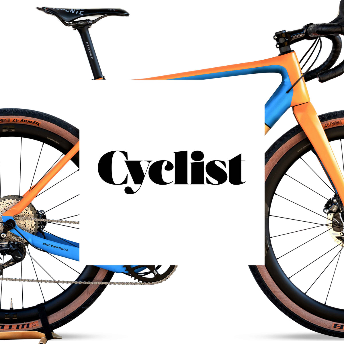 Cyclist magazine logo over an orange and blue gravel bike on a white background