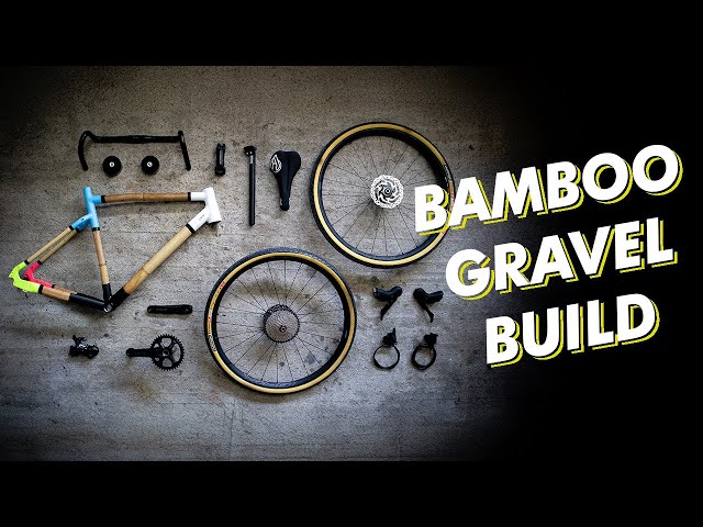 Julian's 'Bamboo gravel build' video thumbnail: bamboo frame, wheels and components laid out on concrete