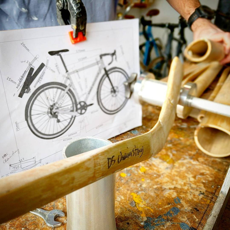 Dan's in the workshop building up his monster gravel grinder, dropped chainstay to squeeze in the ma