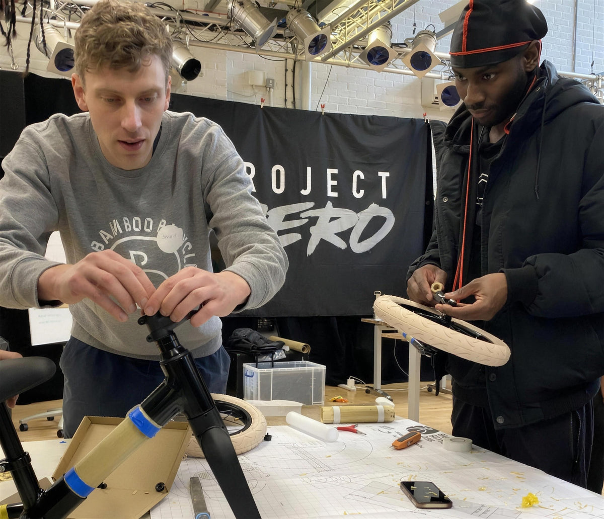 James Marr, our founder, and a young person assembling balance bikes at a Project Zero youth session