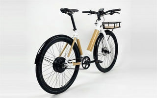 Our bamboo e-bike: white lugs, bamboo tubes, belt drive and a front basket.