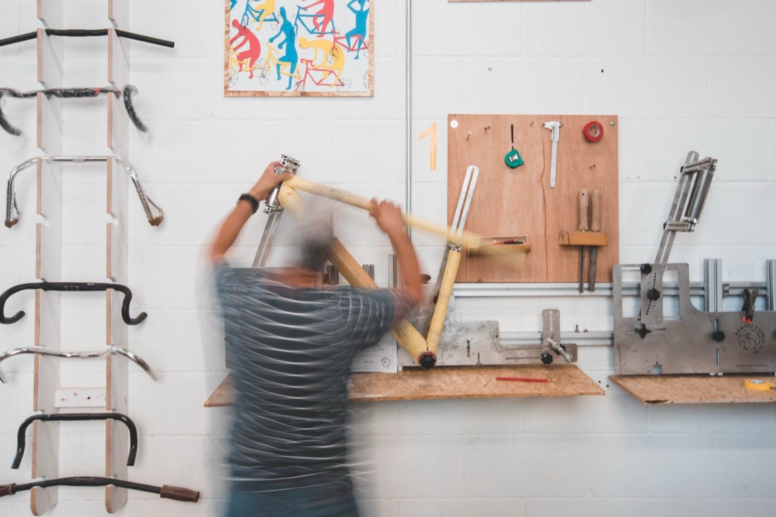 A bamboo frame being built in a jig